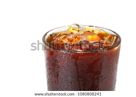 Blow your mind with close up macro photo of ice Americano coffee in glass that look cool and refreshing to make you thirsty.Flash light reflex with Americano glass and water drop to make it look cold. Royalty-Free Stock Photo #1080808241