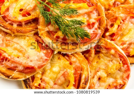 Mix of mini pizzas on a stone try on white background