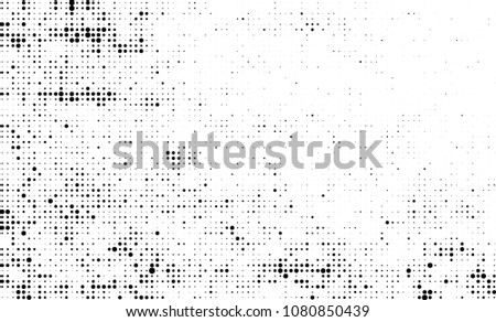 An abstract halftone texture. A chaotic pattern of black dots on a white background