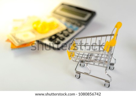 bitcoin and shopping cart on white background