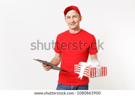 Delivery man in red uniform isolated on white background. Male courier or dealer, holding pen, clipboard with papers document, with blank empty sheet, ed striped gift box with present. Copy space