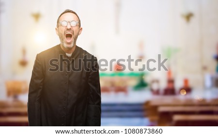 Priest religion man stressful, terrified in panic, shouting exasperated and frustrated. Unpleasant gesture. Annoying work drives me crazy at church