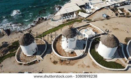 Aerial drone, bird's eye view photo of iconic windmills in Chora of Mykonos island, next to little Venice, Cyclades, Greece