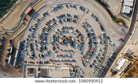Aerial drone bird's eye view photo of public circular parking space built for yachts in chora of Mykonos island, Cyclades, Greece