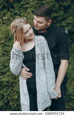 happy couple in love showing affection in a park