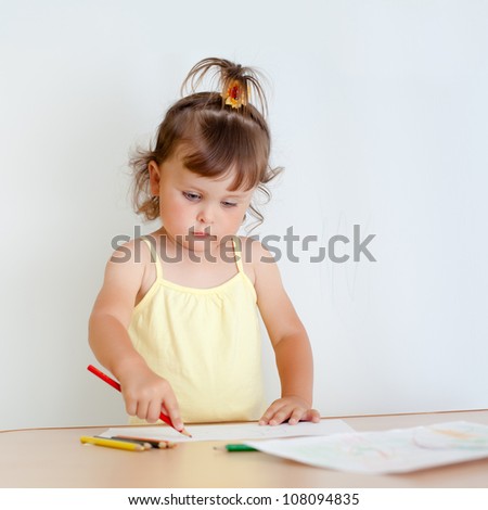 Charming toddler draws. Little girl draws