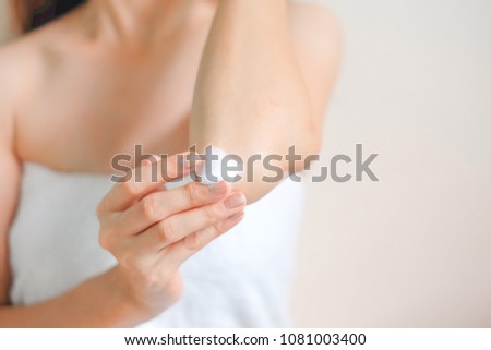 Woman applying elbow cream, Hygiene skin body care concept.
 Royalty-Free Stock Photo #1081003400