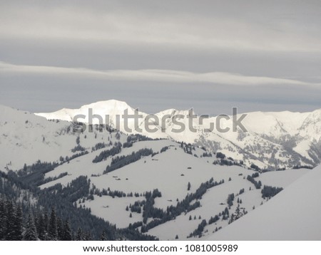 Sumptuous partly cloudy alpine Winter panorama on the high peak of Canton Wallis / Valais - Switzerland