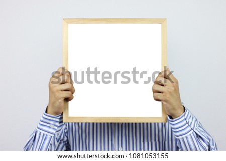 Business men are holding a blank photo frame and have copy space for design in  you work.