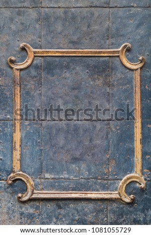 Golden worn out rustic frame on metallic looking steel background