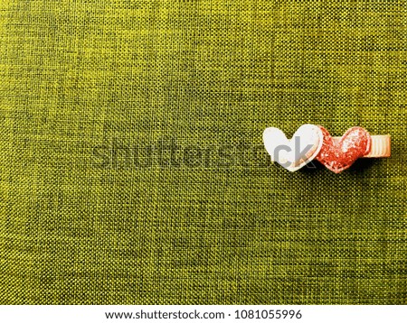 Heart-shaped stick on the dark green silk to write the message.