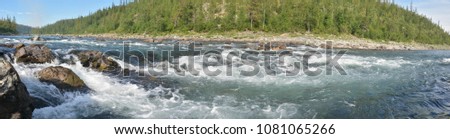 Panorama of the northern river in the Polar Urals. Summer water landscape in Russia.