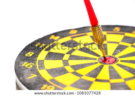Yellow and black color dartboard with number and have the dart hit at red dot on white background (Concept for business focus)