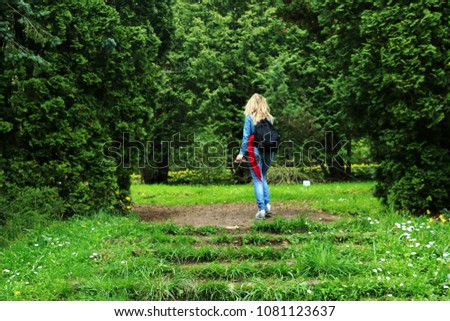 Beautiful young girl walking in the forest,amazing view,Armenia, Yerevan, Dendropark  Royalty-Free Stock Photo #1081123637