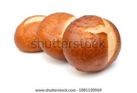 Freshly baked loaf of bread, hot and steaming on white 