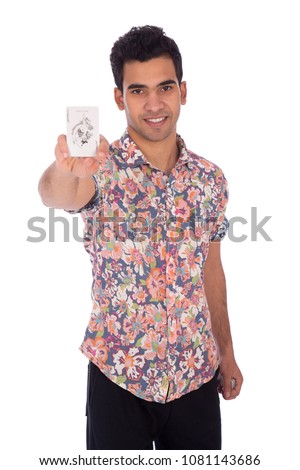 Young man holding the joker card showing it, isolated on a white background.