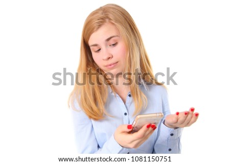 Young girl and mobile. Genuinely surprised.