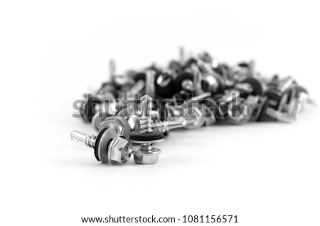 Short screws with a rubber gasket and a drill bit on the end of the thread on a white background.