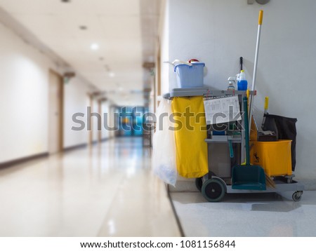 Cleaning tools cart wait for maid or cleaner in the hospital. Bucket and set of cleaning equipment in the hospital. Concept of service, worker and equipment for cleaner and health Royalty-Free Stock Photo #1081156844
