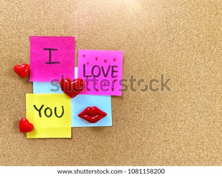 I love you on colorful note pad on the wooden background, love concept, valentines