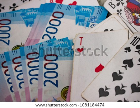 pack of money and playing cards