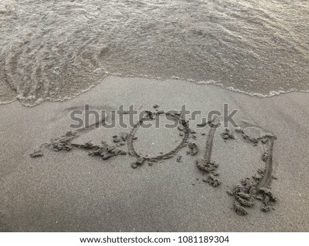 Text 2019 on the beach,sand and sea,new years concept.