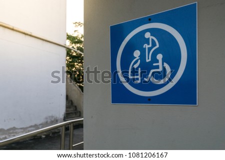 Disability toilet sign and public toilet.