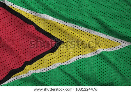 Guyana flag printed on a polyester nylon sportswear mesh fabric with some folds
