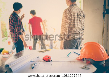 Engineers and businessmen are discussing construction projects in workplace. Construction concept.