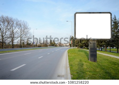 blank Billboard in the side of a road , fork or crossroad with blank billboard