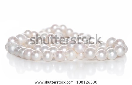 String of pearls on white background with reflection Royalty-Free Stock Photo #108126530