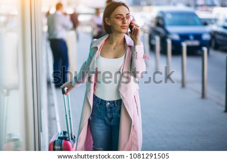Woman with phone travelling