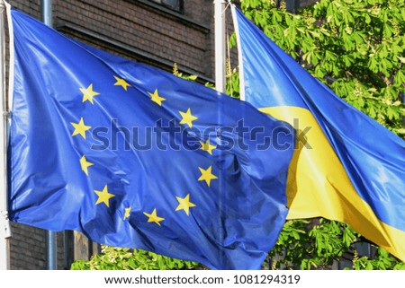 The flag of the European Union (Left) and flag of Ukraine (Right)