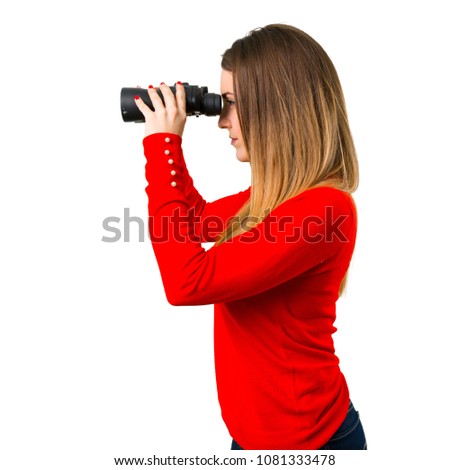 Young blonde woman with binoculars