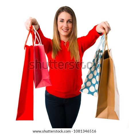 Happy Young blonde woman with shopping bag