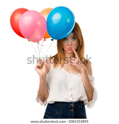 Sad beautiful young girl holding a balloon