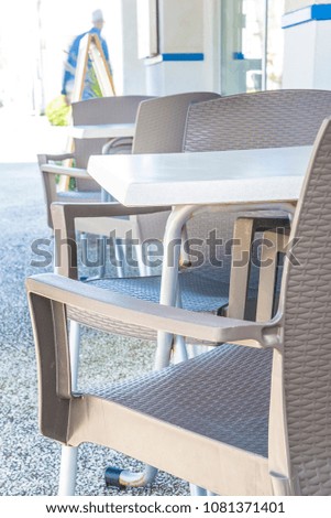Empty tables in a restaurant, vertical picture with selective focus