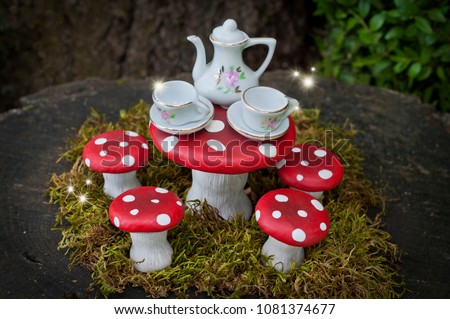 Tea party with fairies in forest 