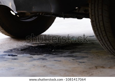 Oil leakage from old car. Royalty-Free Stock Photo #1081417064