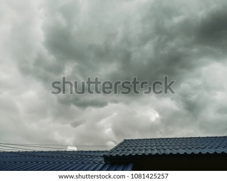 Cloudy rooftop and wires