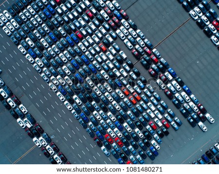 Aerial photograph of many cars before shipment.
High angle.
