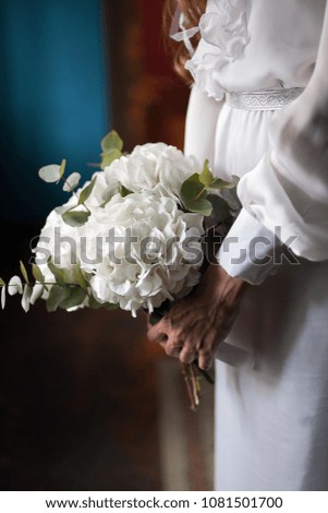 Bride holding wedding bouquet on wedding ceremony