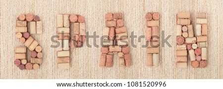 Word SPAIN made of wine corks on jute rope background. Banner