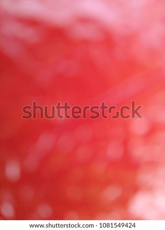 Abstract out of focus lights coming from the mother nature with abstract background of Red fruit. Abstract background of Red and White color. 