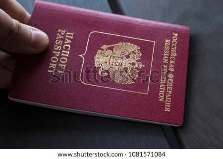 Closeup of man holding passports on passport control. Travel concept