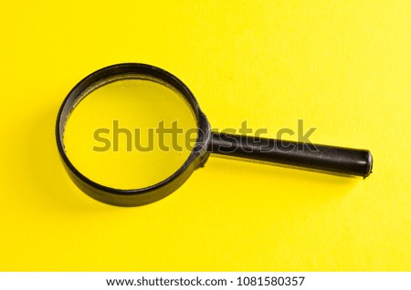 Vintage Magnify Glass Loupe on a Colored Background