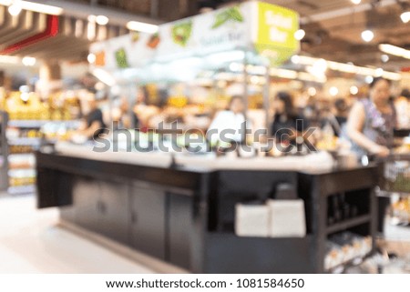 abstract blur and defocused shoppers at salad bar  in modern supermarket for background
