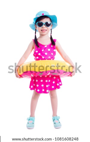 Little asian girl in swim suit smiling over white background