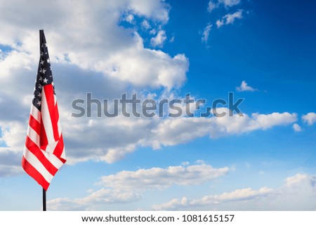 American flag on blue sky. Nature background