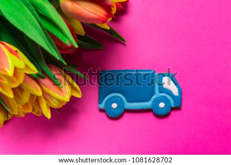 Bouquet of Tulips on pink background, flowers delivery concept